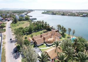 an aerial view of a resort next to a body of water at SEA SAND RESORT in Kampot