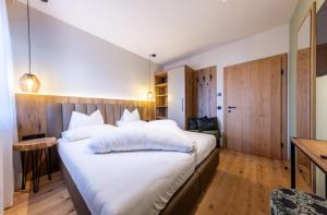 Postel nebo postele na pokoji v ubytování Höflehner Premium Gumpen Lodge