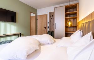 Postel nebo postele na pokoji v ubytování Höflehner Premium Gumpen Lodge