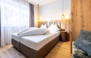 Postel nebo postele na pokoji v ubytování Höflehner Premium Gumpen Lodge