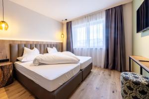 Postel nebo postele na pokoji v ubytování Höflehner Premium Gumpen Lodge