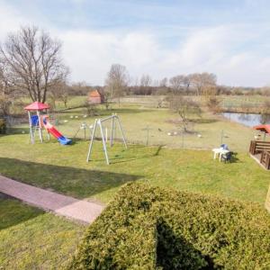 a park with a playground with a swing at Fehmarn 17-5 in Fehmarn