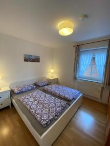 Postel nebo postele na pokoji v ubytování Fehmarn 17-4