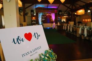 a sign with a heart on it in a banquet hall at Southdrive Beach Resort in Bulalakao