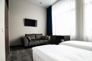 Tempat tidur dalam kamar di AN Hotel