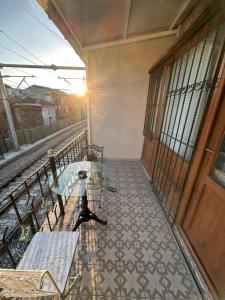 a balcony with a table and benches on a building at Big Orange Hotel Old City in Istanbul +190 photos