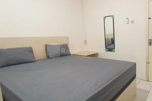 Ένα ή περισσότερα κρεβάτια σε δωμάτιο στο Guest House 88 Lahat RedPartner