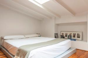 A bed or beds in a room at Mercato Flexyrent - A.C. - WiFi