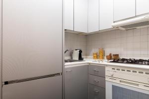 A kitchen or kitchenette at Mercato Flexyrent - A.C. - WiFi