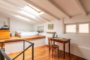 A bed or beds in a room at Mercato Flexyrent - A.C. - WiFi
