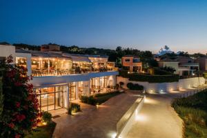 a view of a building at night with lights at St John Villas Zakynthos in Tsilivi