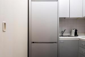 A kitchen or kitchenette at Mercato Flexyrent - A.C. - WiFi