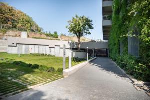 a building with a walkway in front of a building at Camplus San Pietro in Rome