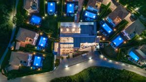 an aerial view of a villa at night at St John Villas Zakynthos in Tsilivi