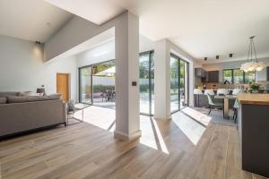 a living room with a couch and a table at Court House, Aldeburgh in Aldeburgh