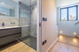 a bathroom with a shower and a sink at Court House, Aldeburgh in Aldeburgh +40 photos