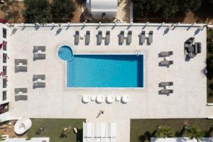 an overhead view of a building with a swimming pool at White Dunes Luxury Boutique Hotel in Santa Maria