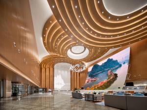 TV a/nebo společenská místnost v ubytování Wyndham Grand Zhaoqing Downtown
