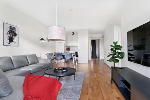 a living room with a couch and a table at Guestly Homes - 3BR Corporate Comfort in Boden