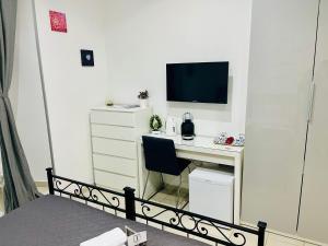 A television and/or entertainment centre at ImeraRooms