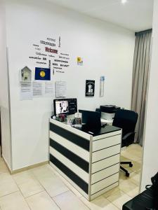 A television and/or entertainment centre at ImeraRooms