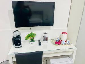 A television and/or entertainment centre at ImeraRooms