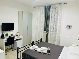 A television and/or entertainment centre at ImeraRooms