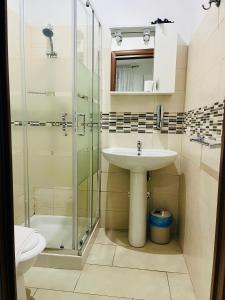 A bathroom at ImeraRooms