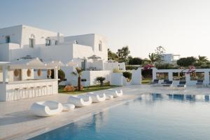 a resort with a swimming pool and white buildings at White Dunes Luxury Boutique Hotel in Santa Maria