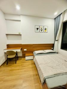 En eller flere senge i et værelse på Căn hộ The Rivana 2 phòng ngủ đầy đủ tiện nghi tại Thuận An, Bình Dương