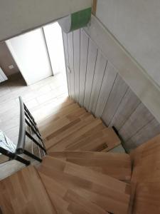 a staircase in a house with a wooden floor at MaisonnetteAu36-centre-parking-cosy in Angoulême