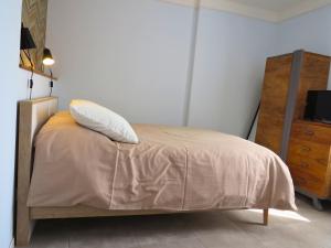 Postel nebo postele na pokoji v ubytování Maison d'hôtes La Bignone