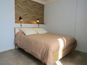 Postel nebo postele na pokoji v ubytování Maison d'hôtes La Bignone