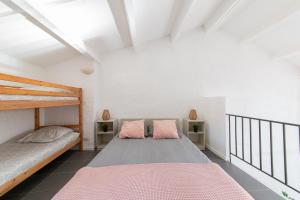 a bedroom with two beds in a room at Le Verdon - Superbe appt vue montagne in Riez