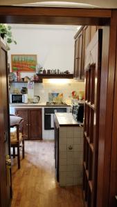 a kitchen with a stove and a counter top at Tre Gigli Firenze BB, 5 minutes from station, via Palazzuolo 55 in Florence