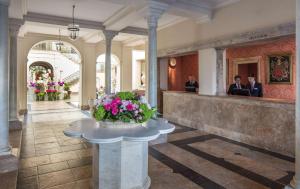 a lobby of a building with a vase of flowers at Anantara Villas & Suites Marbella Benahavis in Estepona