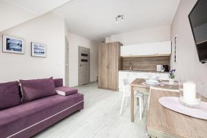 Η κουζίνα ή μικρή κουζίνα στο Apartamenty przy Plaży - Promenada Mielno by Noclegi Renters