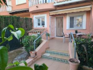 a house with a staircase leading to a patio at Casa Sofia in Els Poblets in Els Poblets