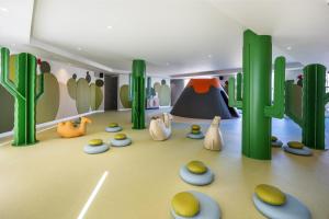 a rendering of a play room with cactus at Barceló Playa Blanca in Playa Blanca