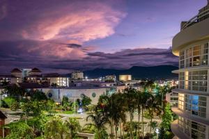 a view of a city at night at DoubleTree by Hilton Cairns in Cairns