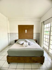 Ένα ή περισσότερα κρεβάτια σε δωμάτιο στο Loft Zona Sul próximo ao mar +9 φωτογραφίες