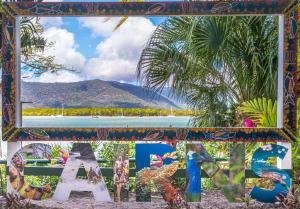 a picture of a sign with a mountain in the background at Hilton Cairns in Cairns