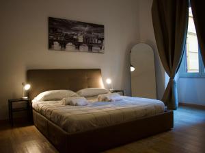 Giường trong phòng chung tại Lavinia Apartment In Trastevere