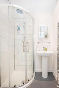 a bathroom with a shower and a sink at The Clifton Hotel Bristol in Bristol