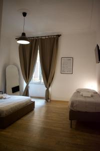 Voodi või voodid majutusasutuse Lavinia Apartment In Trastevere toas