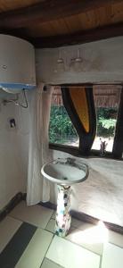 a table in the back of a camper with a window at Cabaña bosque y mar in Salinas  +29 photos