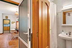 a bathroom with a toilet and a sink at Finca Candelario sc de La Palma in Santa Cruz de la Palma +12 photos