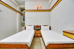 Letto o letti in una camera di FabHotel Prime Manjeet
