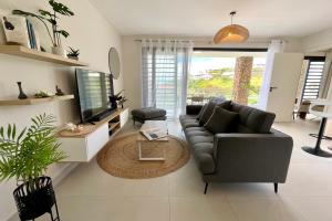Istumisnurk majutusasutuses Tetavake Sunset stunning 2 bedroom condo with Moorea view pool and WiFi