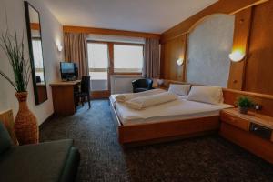 TV a/nebo společenská místnost v ubytování Hotel Tia Apart